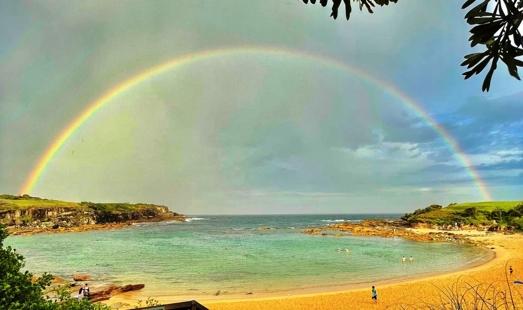 Little Bay Beach with rainbow